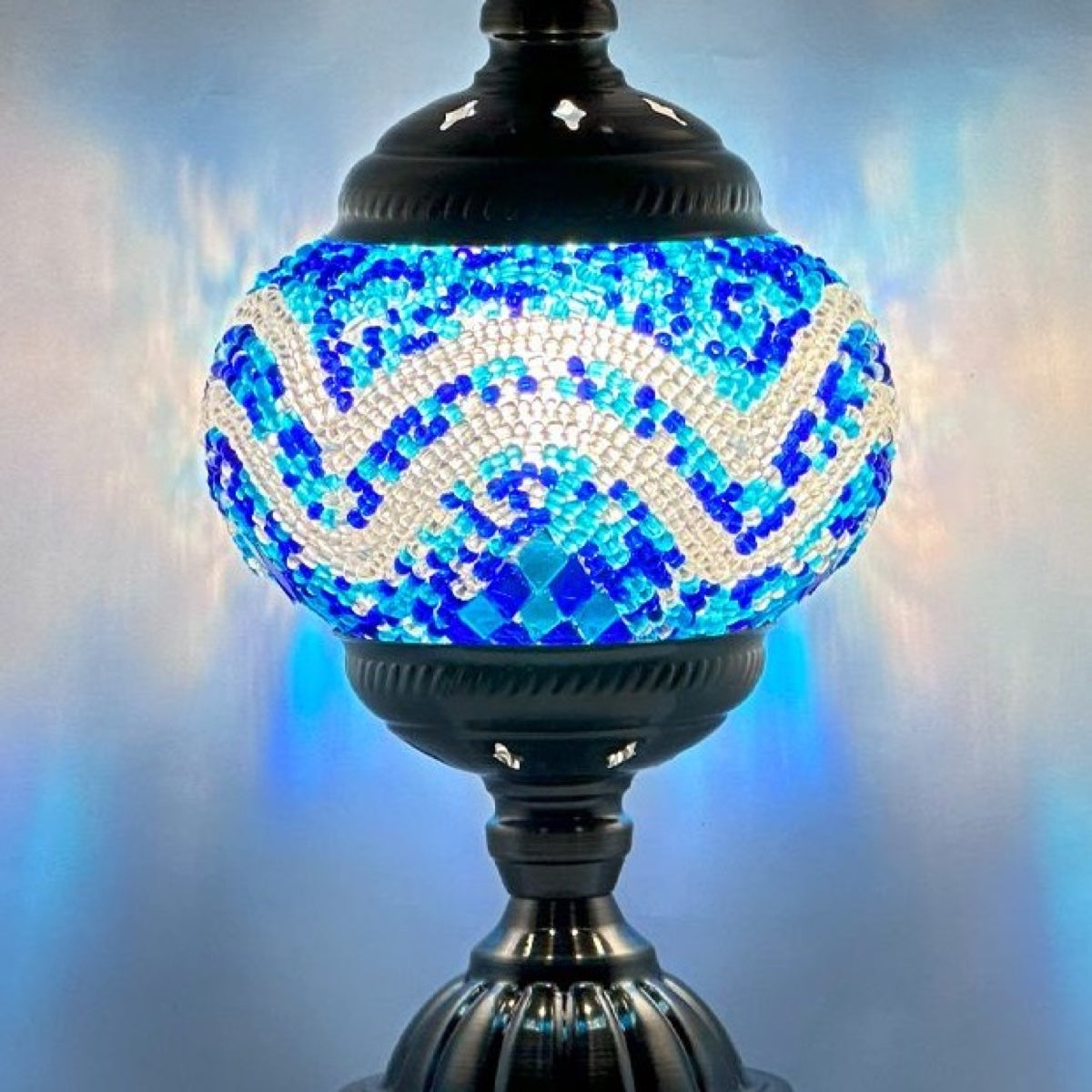 Close-up of the blue and white chevron mosaic glass on the Deep Ocean lamp