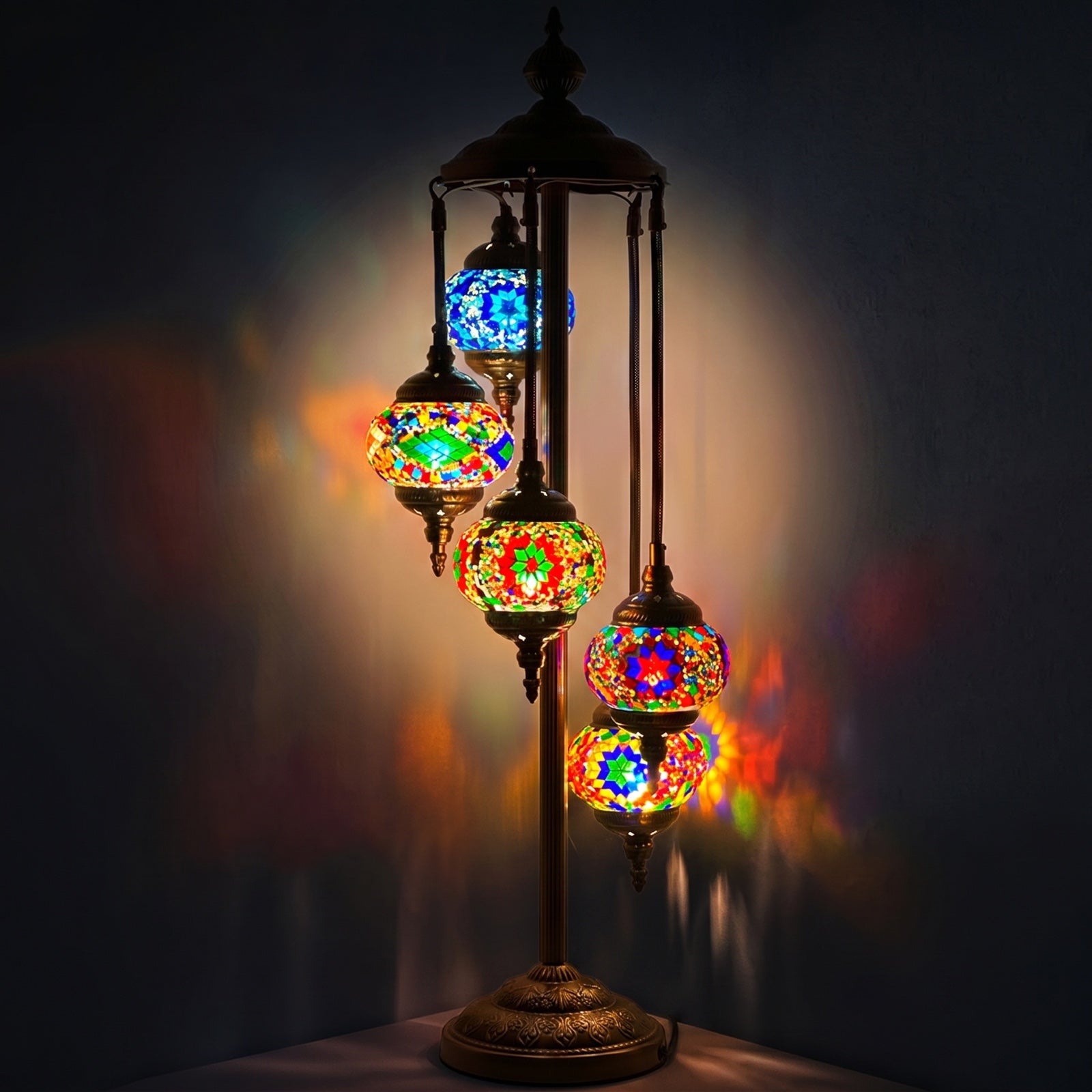 Enchanted Mystic Garden mosaic glass table lamp — glowing against a deep charcoal background