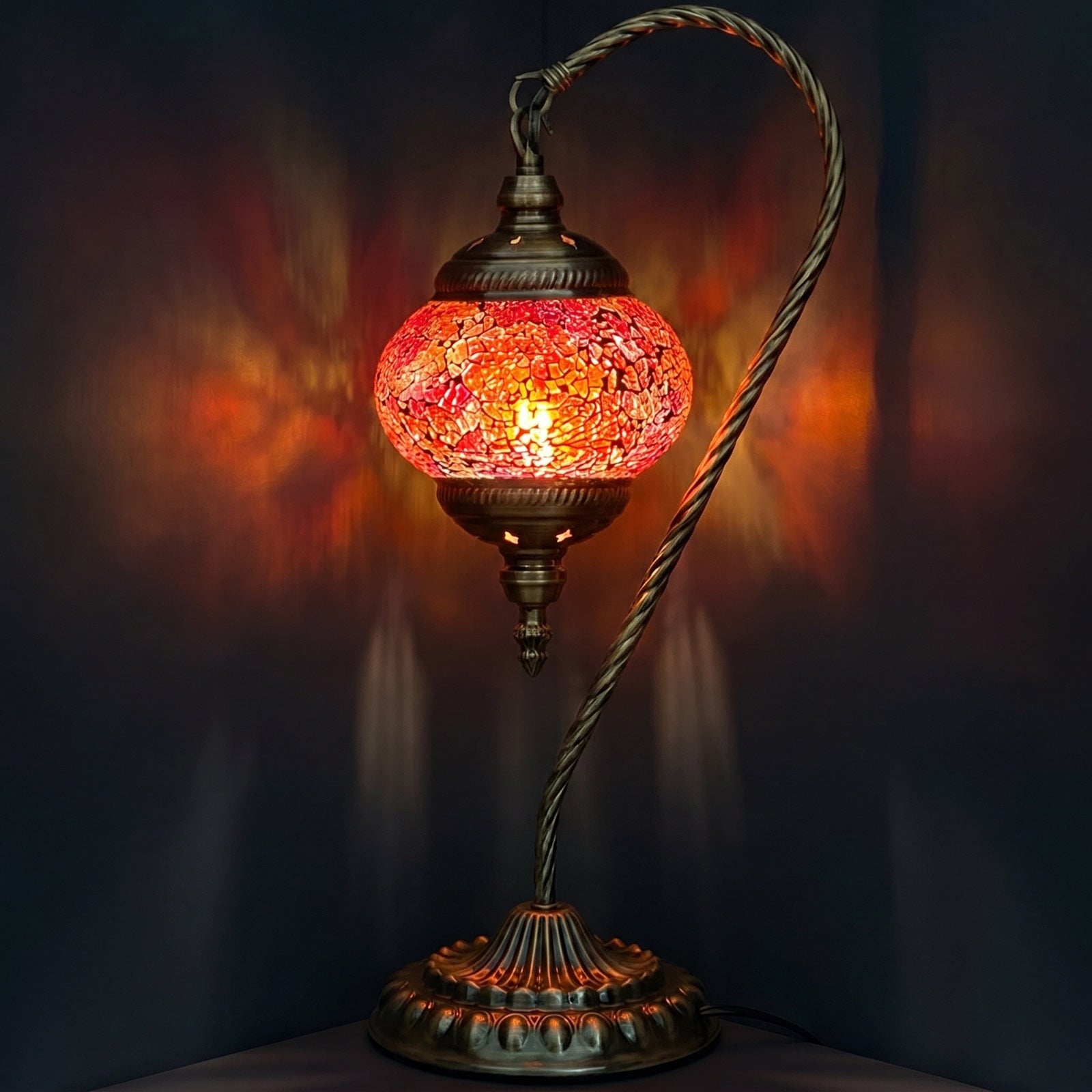 Fiery Grace mosaic glass table lamp — glowing against a deep charcoal background