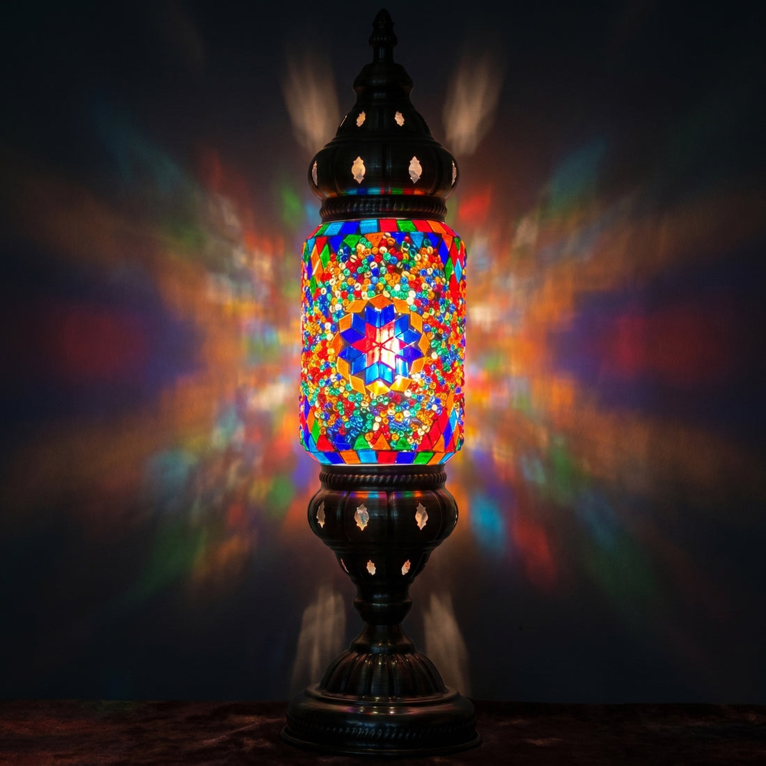 Floral Turkish Lamp in Blue & Purple mosaic glass table lamp — glowing against a deep charcoal background