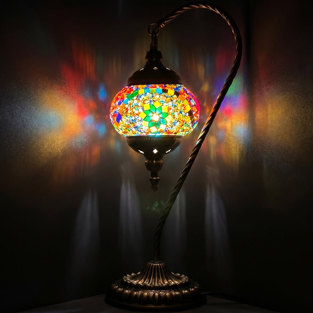 Goose Neck Mosaic Lamp with Colorful Flower Design mosaic glass table lamp — glowing against a deep charcoal background