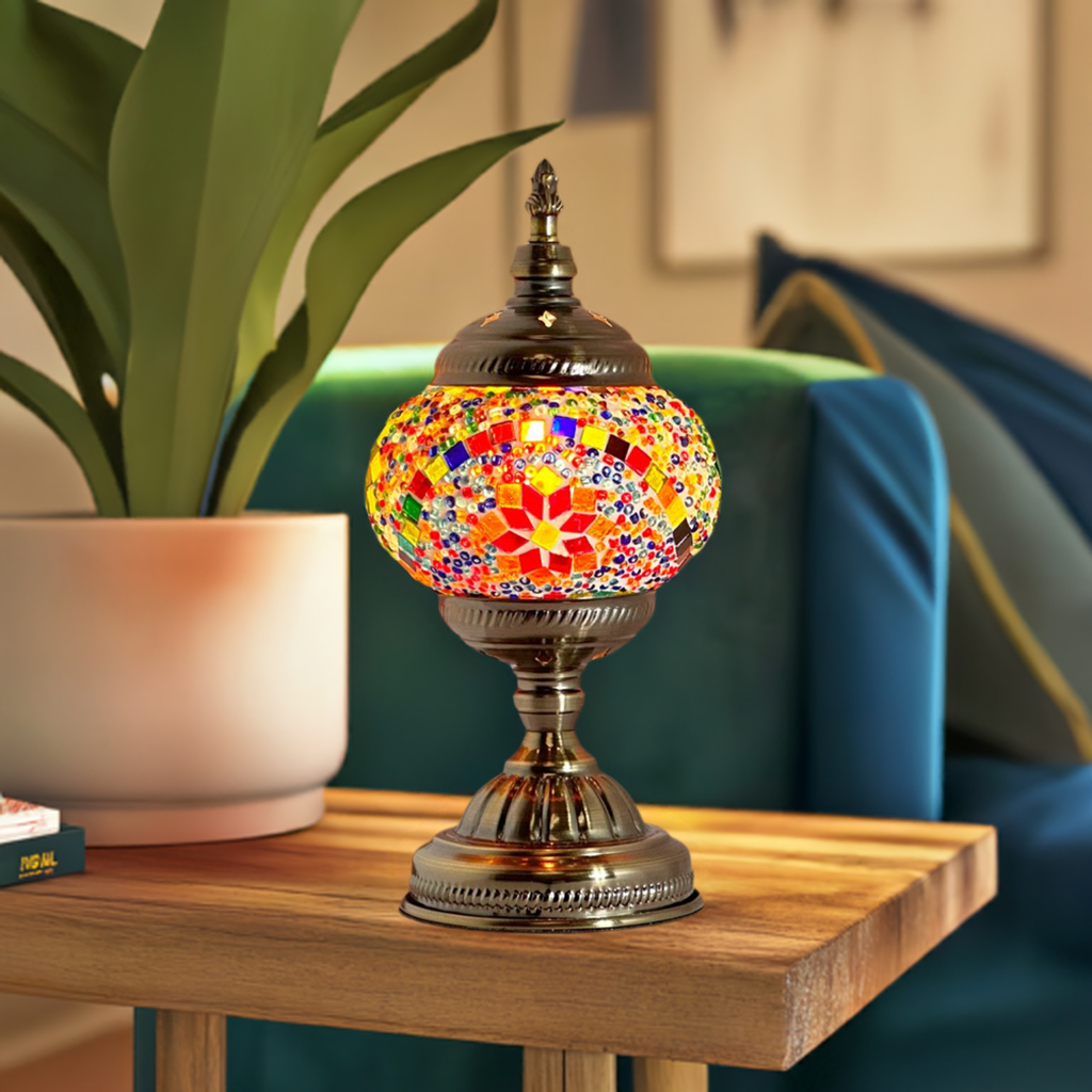 Multicolored Blossom mosaic glass table lamp — glowing in a styled room