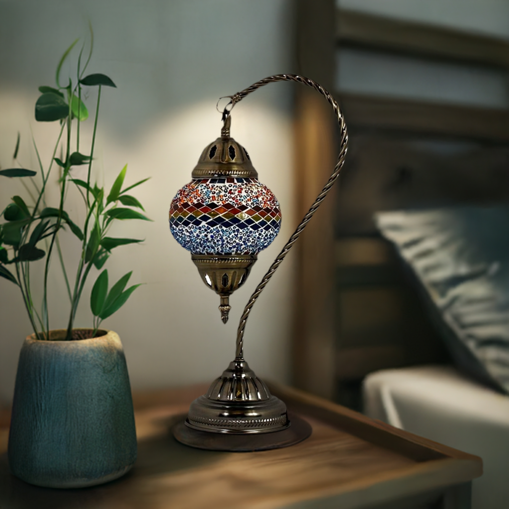 Iridescent Swan Neck mosaic glass table lamp — on a nightstand