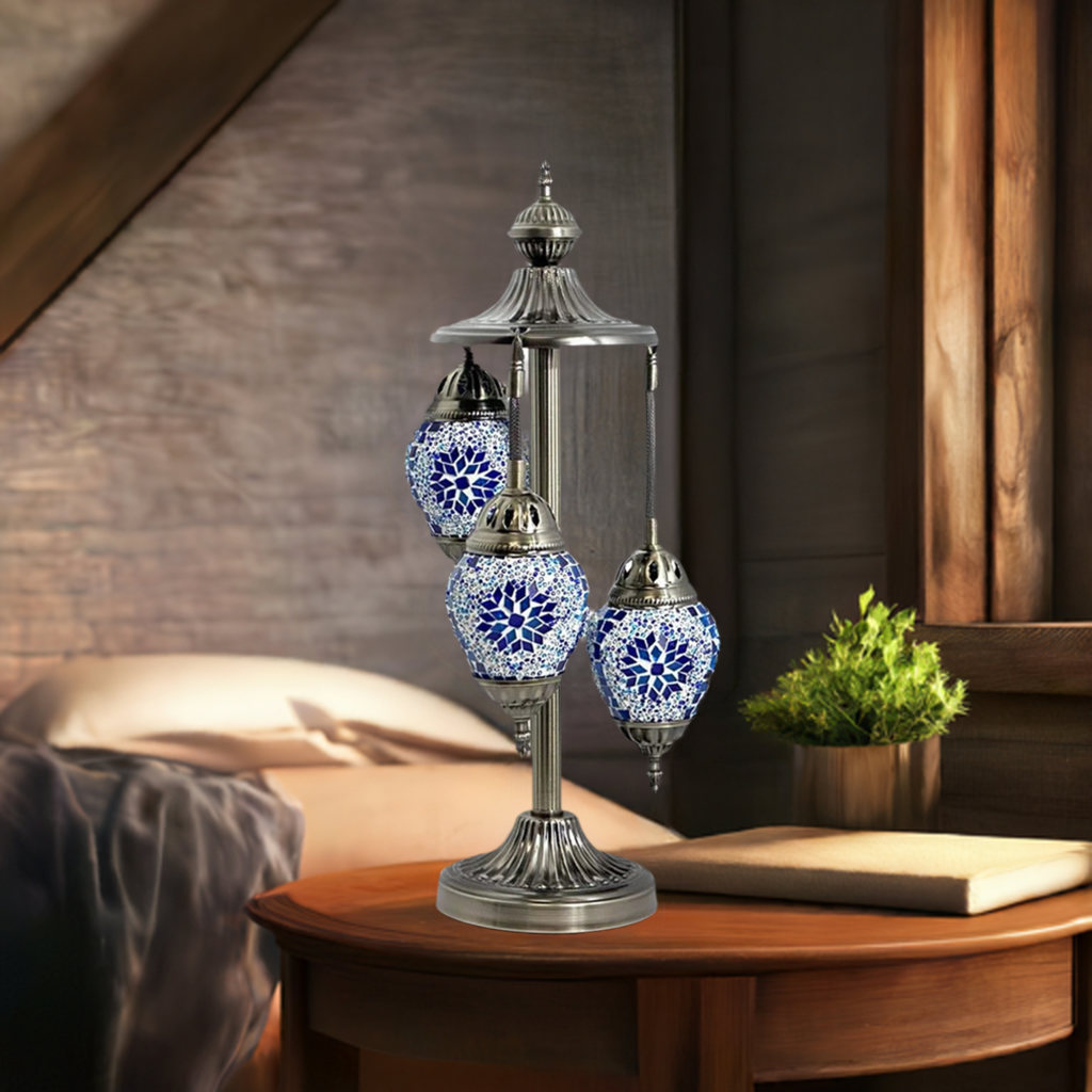 Midnight Blue Cosmos Egg mosaic glass table lamp — on a nightstand