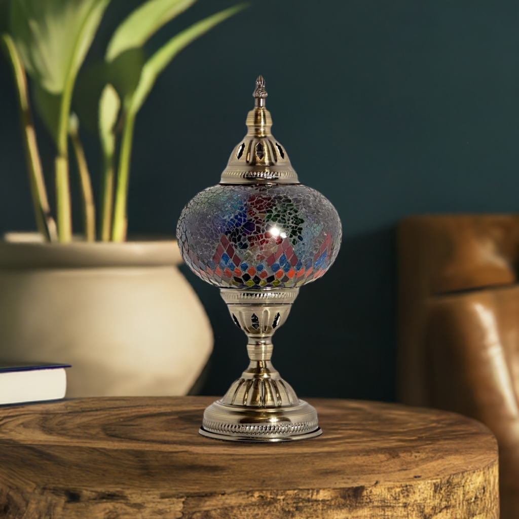 Cosmic Rainbow Bridge mosaic glass table lamp — on a nightstand
