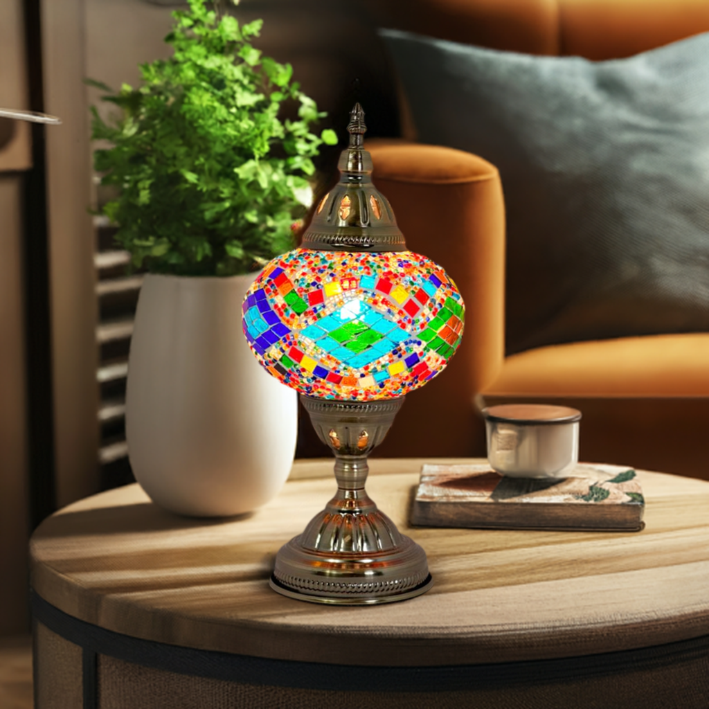 Kaleidoscopic Diamond Road mosaic glass table lamp — glowing in a styled room