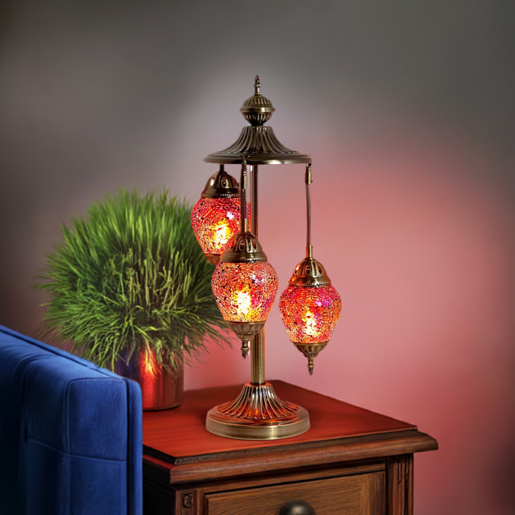 Cosmic Red Hues Egg mosaic glass table lamp — glowing in a styled room