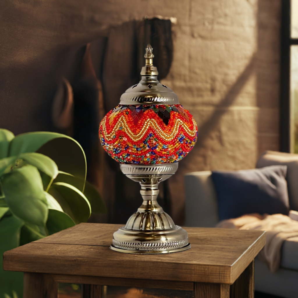 Fiery Echoes mosaic glass table lamp — on a nightstand