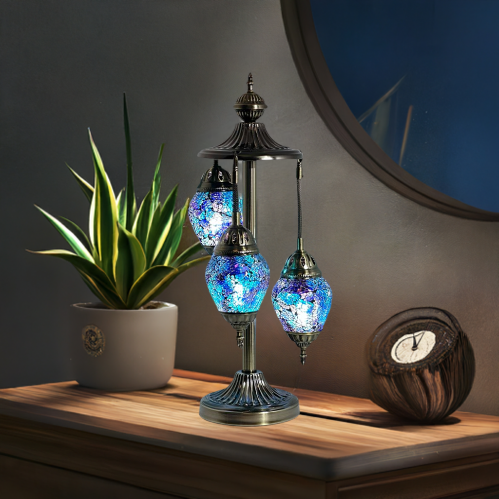 Nautical Navy Blue mosaic glass table lamp — glowing in a styled room