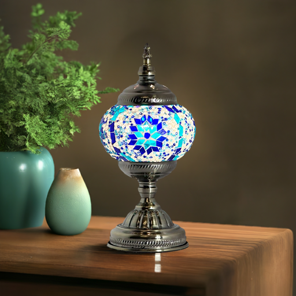 Moroccan mosaic glass table lamp — glowing in a styled room