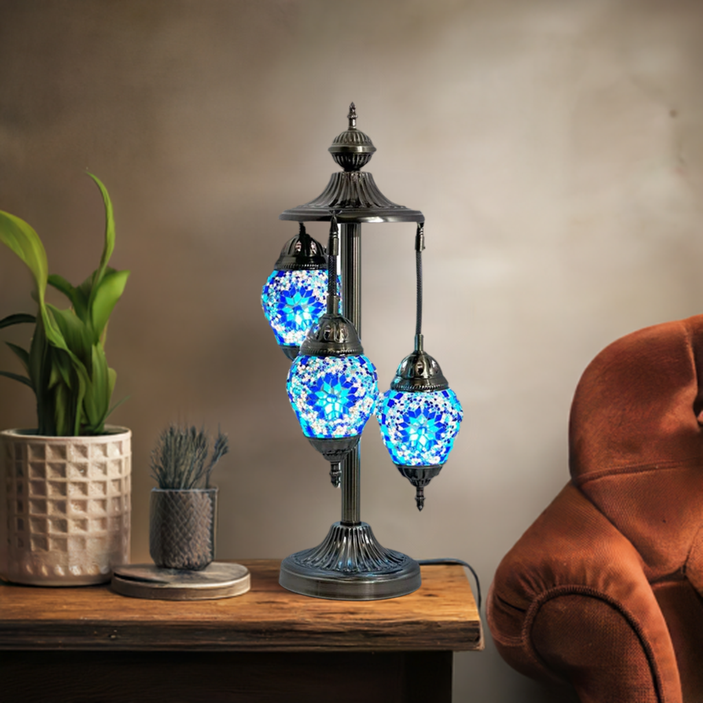 Midnight Blue Cosmos Egg mosaic glass table lamp — glowing in a styled room