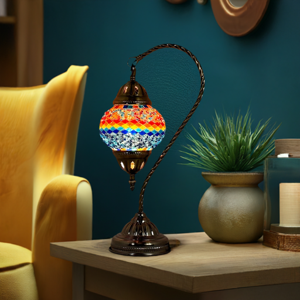 Iridescent Swan Neck mosaic glass table lamp — glowing in a styled room