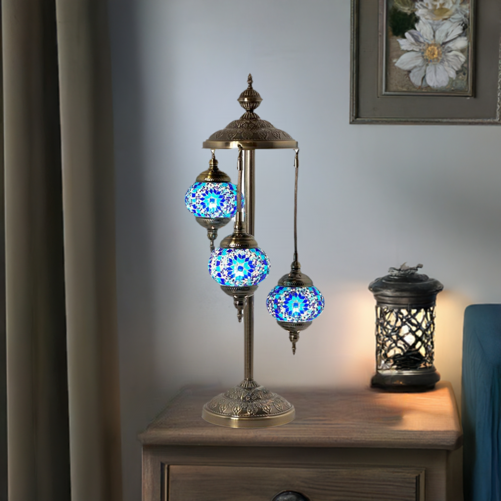 Blue Star Magic mosaic glass table lamp — glowing in a styled room