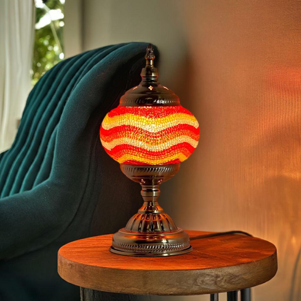 Golden Sands mosaic glass table lamp — glowing in a styled room