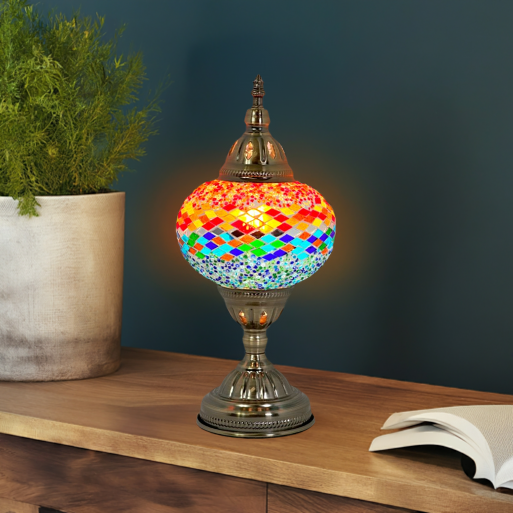 Fusion of Warm and Cool mosaic glass table lamp — glowing in a styled room