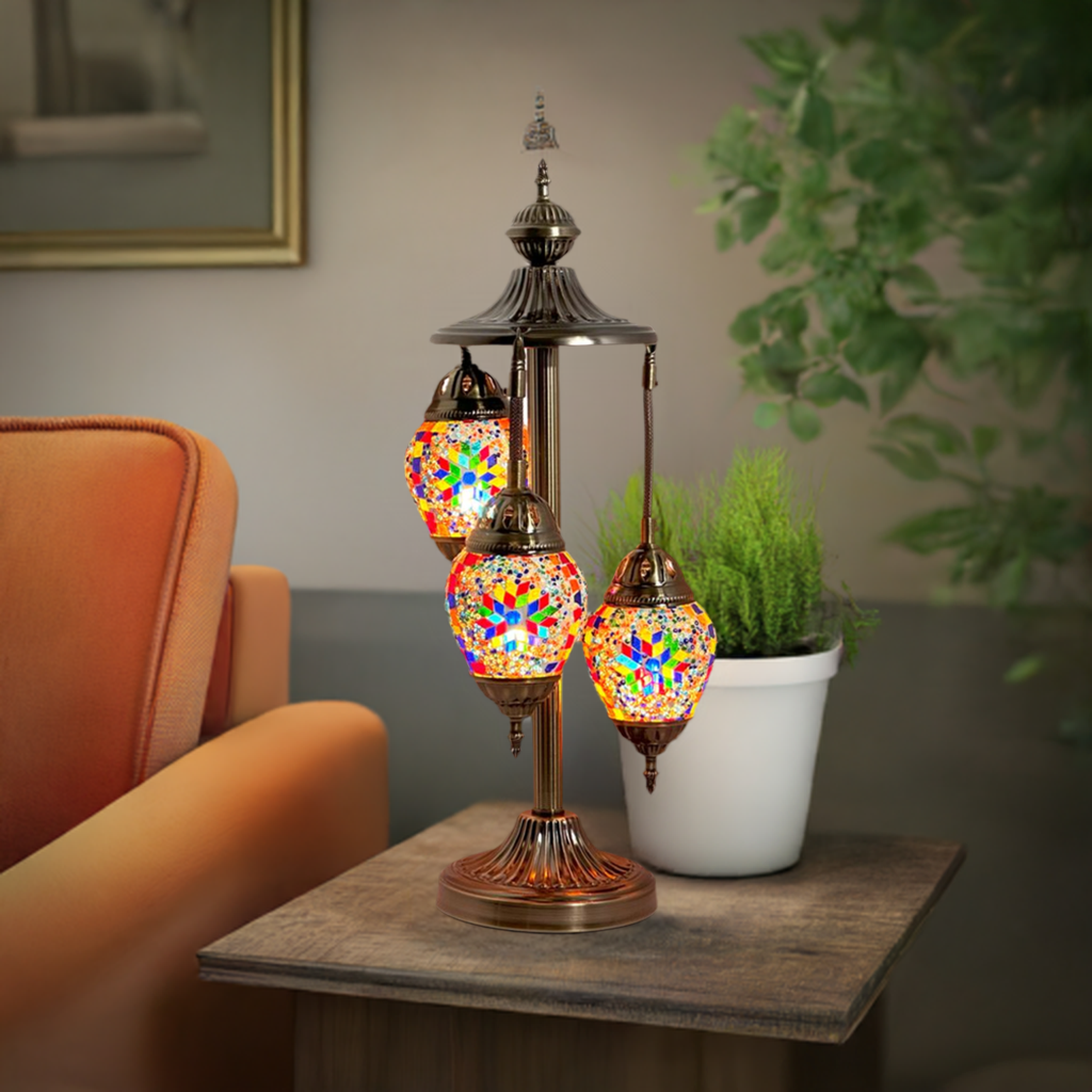 Floral Spectacle mosaic glass table lamp — glowing in a styled room