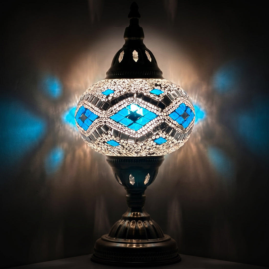Icy Elegance mosaic glass table lamp — glowing against a deep charcoal background