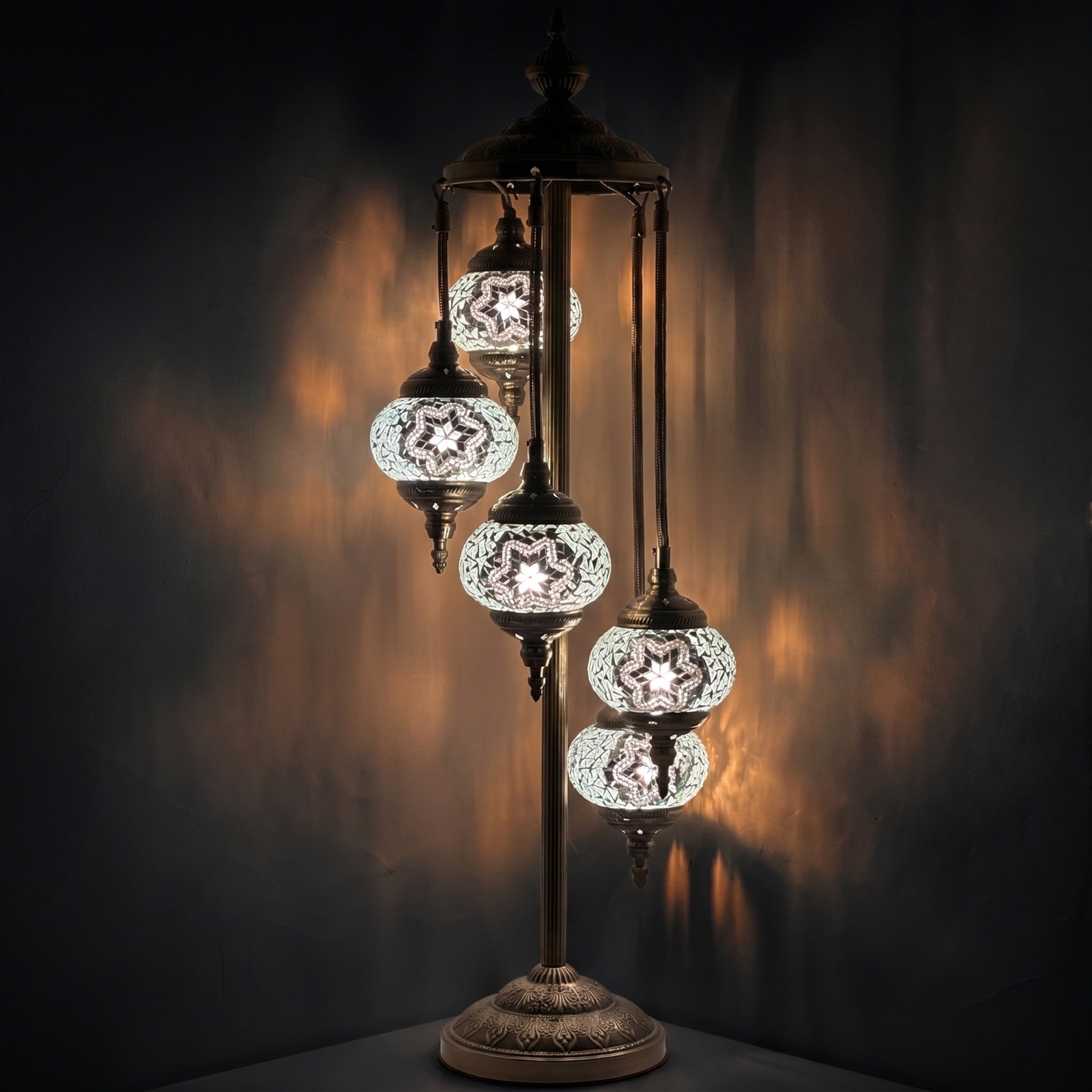 Lunar Glow mosaic glass table lamp — glowing against a deep charcoal background