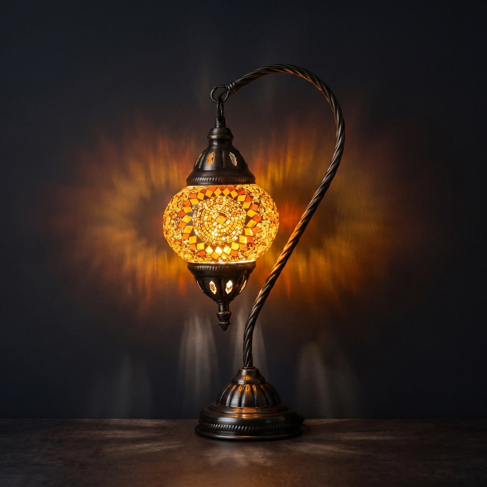 Marrakech Nights mosaic glass table lamp — glowing against a deep charcoal background