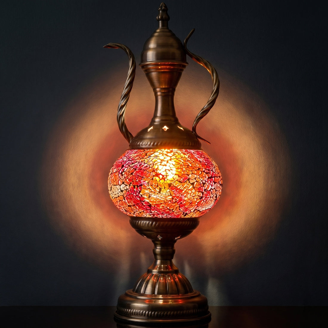 Mediterranean Allure mosaic glass table lamp — glowing against a deep charcoal background