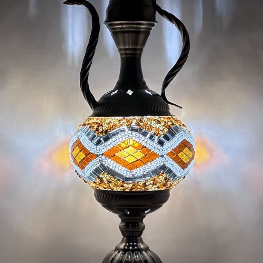 Moroccan Golden Diamonds Teapot Lamp with Vintage Charm mosaic glass table lamp — glowing against a deep charcoal background