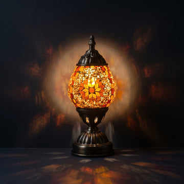Mosaic Bedside Lamps with Bright Yellow colors mosaic glass table lamp — glowing against a deep charcoal background