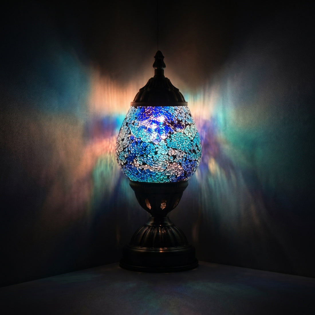 Mosaic Desk Lamp with Cosmic Blue mosaic glass table lamp — glowing against a deep charcoal background