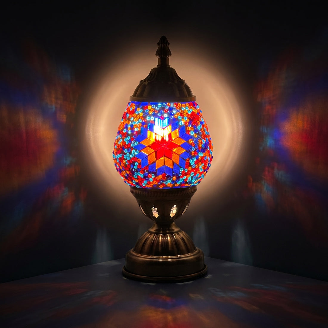 Mosaic Desk Lamps with Hot Blue colors mosaic glass table lamp — glowing against a deep charcoal background