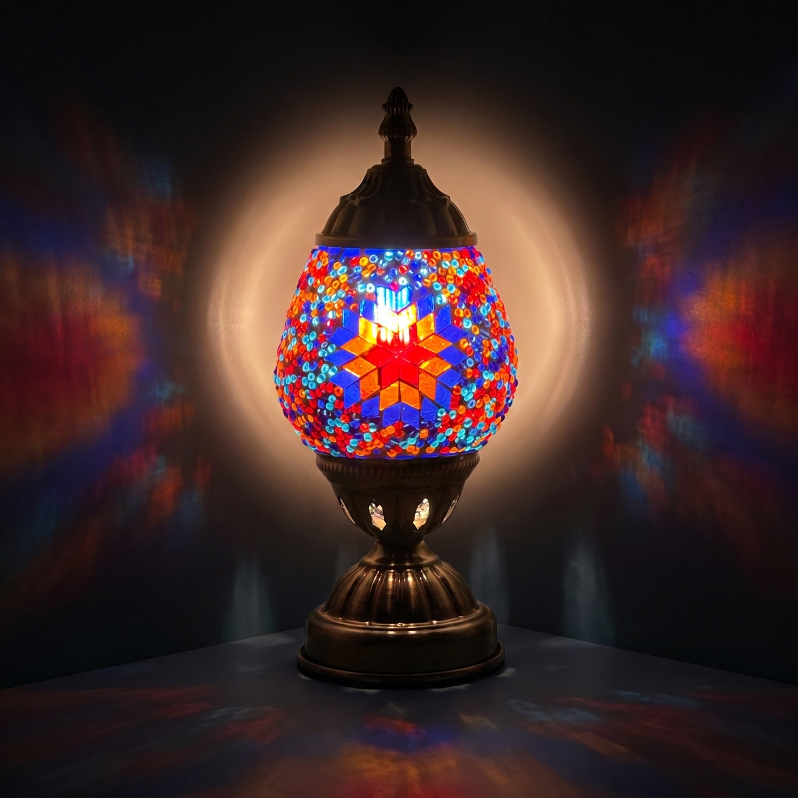 Mosaic Desk Lamps with Hot Blue colors mosaic glass table lamp — glowing against a deep charcoal background