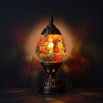 Mosaic Table Lamps with Cosmic Golden colors mosaic glass table lamp — glowing against a deep charcoal background