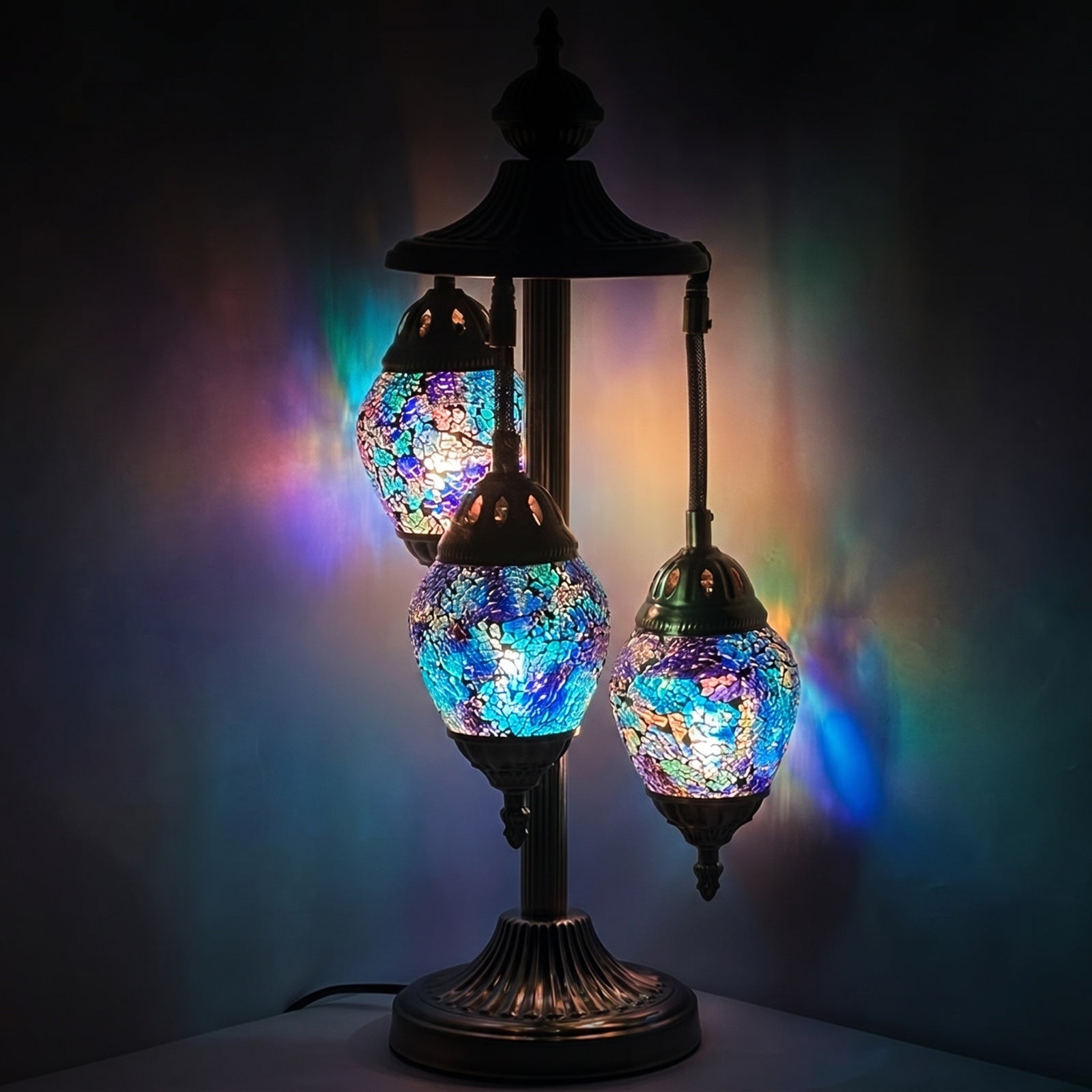 Nautical Navy Blue mosaic glass table lamp — glowing against a deep charcoal background