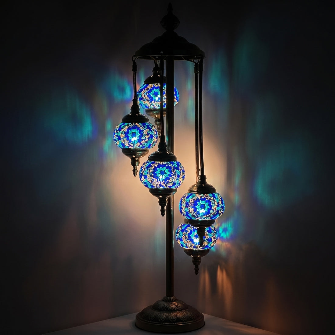 Oceanic Dreams mosaic glass table lamp — glowing against a deep charcoal background