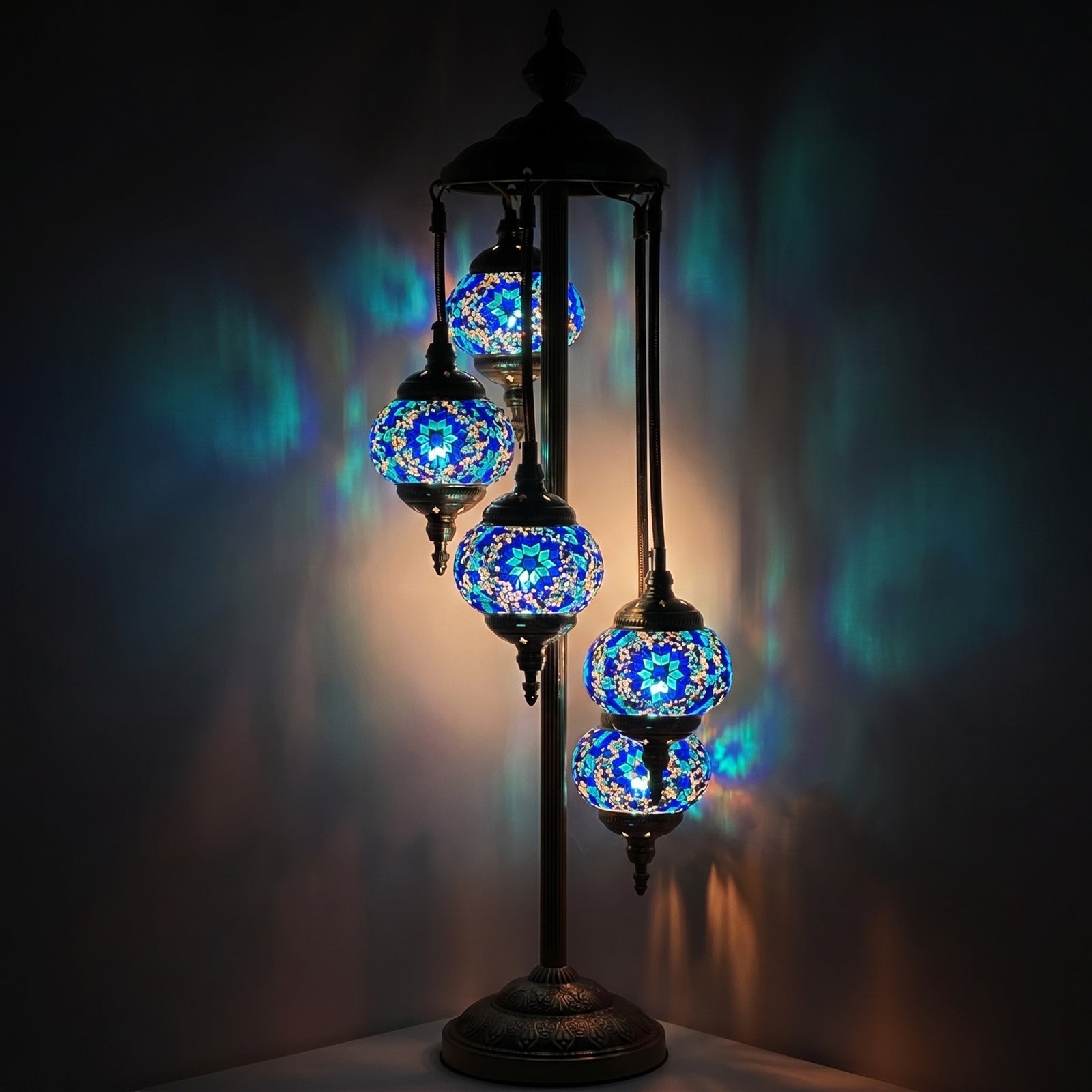 Oceanic Dreams mosaic glass table lamp — glowing against a deep charcoal background