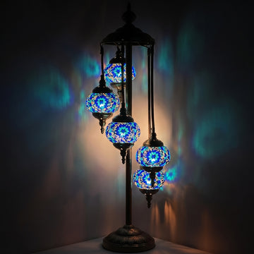 Oceanic Dreams mosaic glass table lamp — glowing against a deep charcoal background