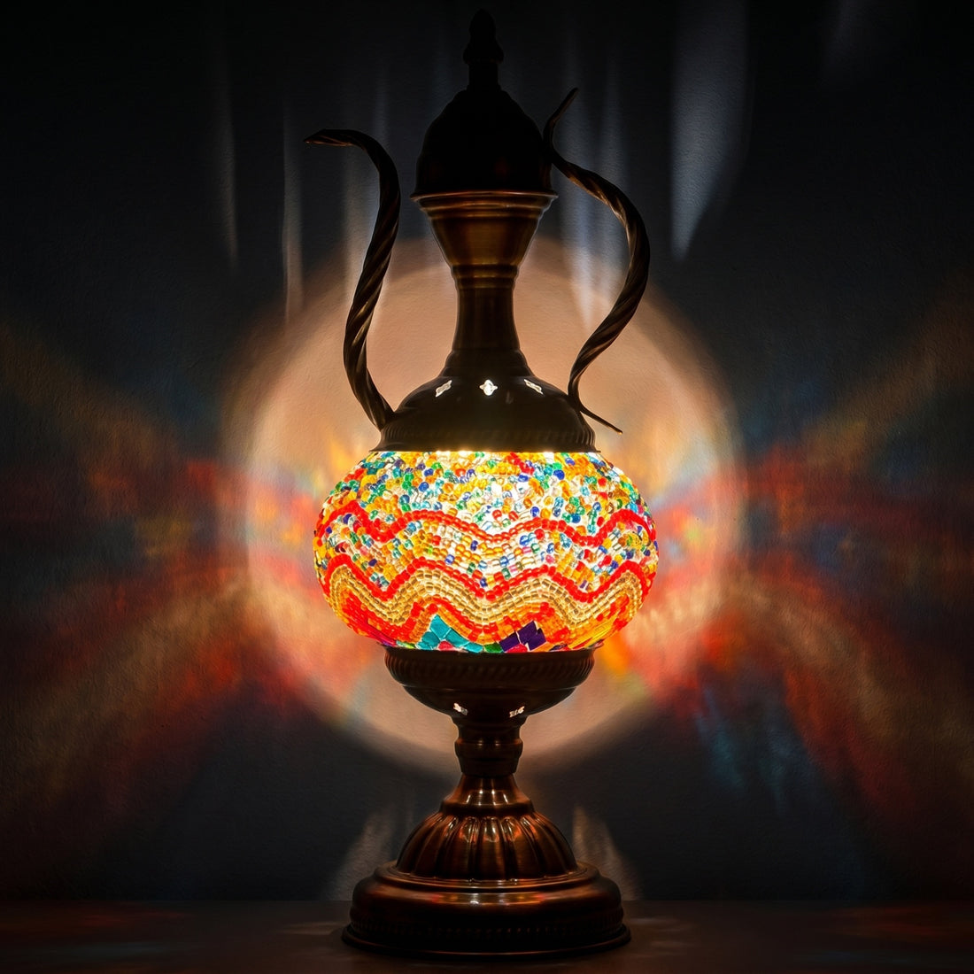 Orange Vintage Lamps with Mosaic Pitcher Style mosaic glass table lamp — glowing against a deep charcoal background