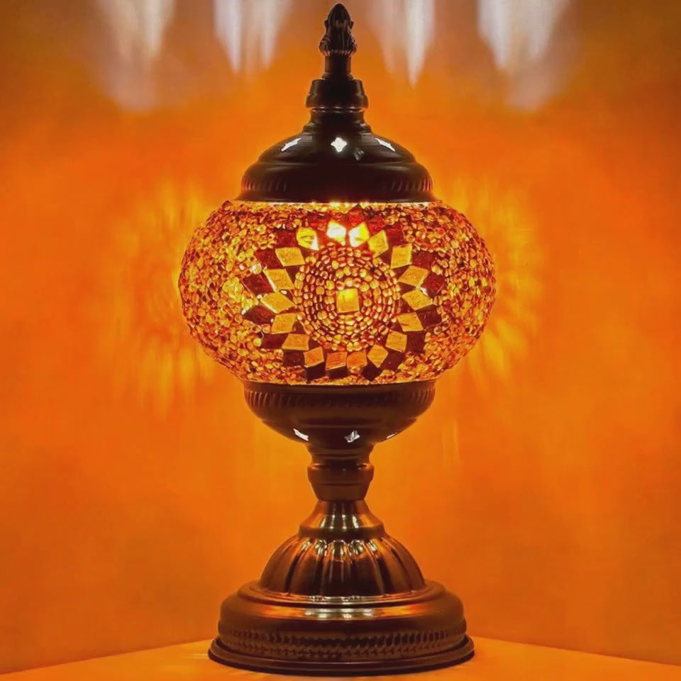 360 degree rotating view of an orange mosaic glass lamp showcasing its handcrafted beaded shade from every angle