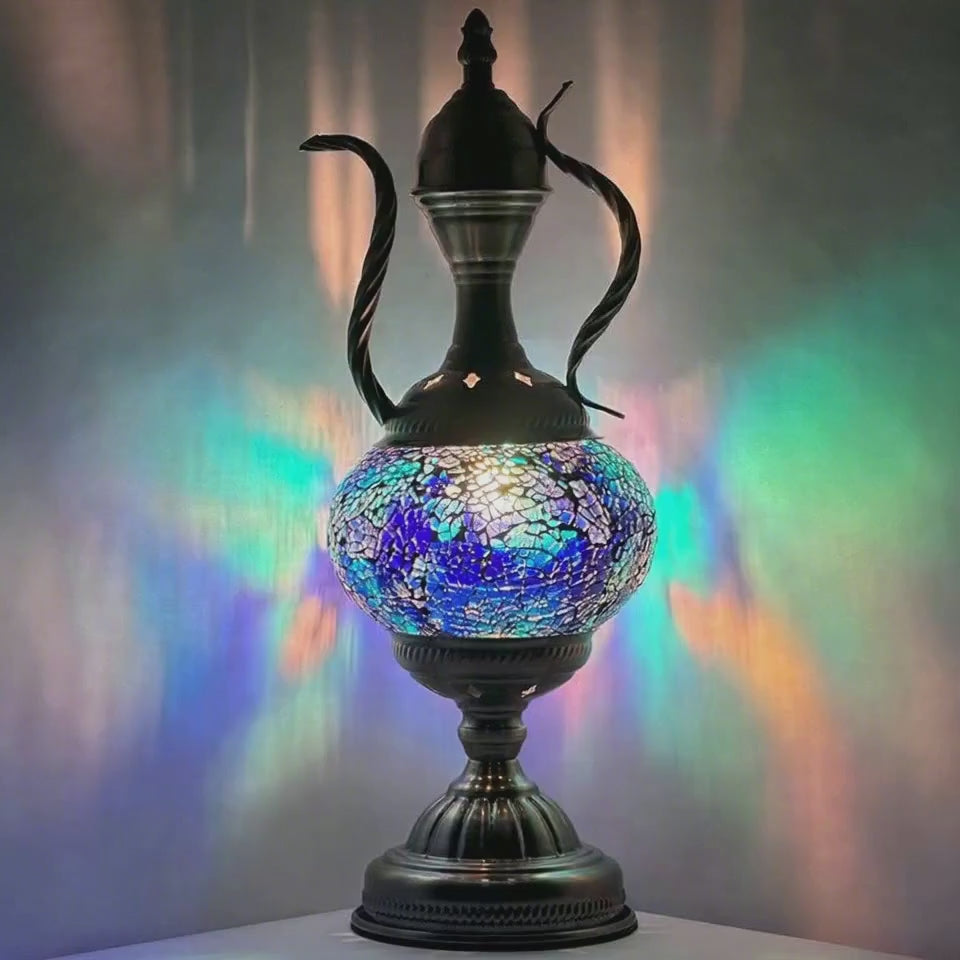 360-degree rotating view of the illuminated mosaic glass ewer table lamp revealing every glass tile facet