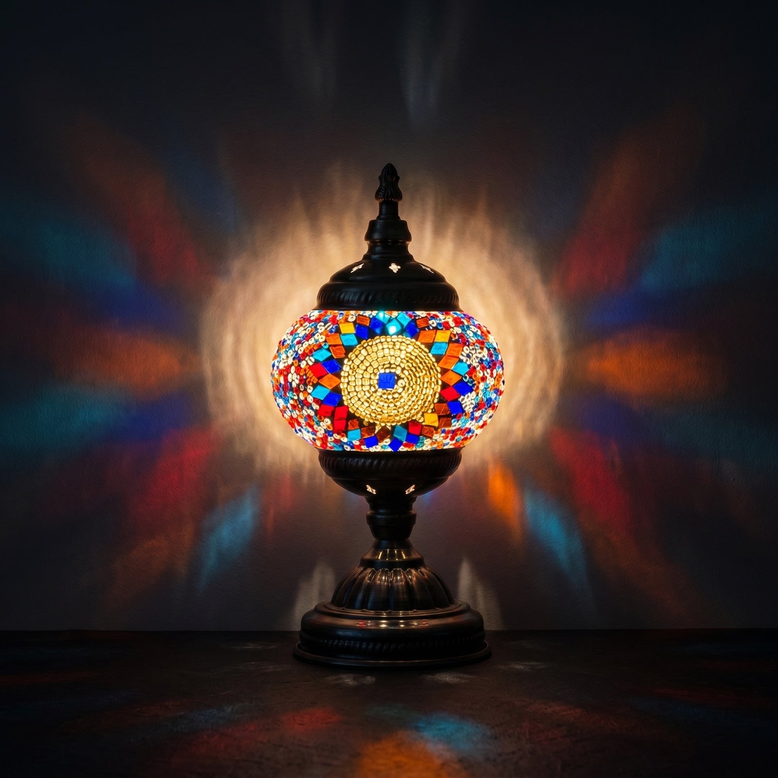 Prismatic Fantasy mosaic glass table lamp — glowing against a deep charcoal background
