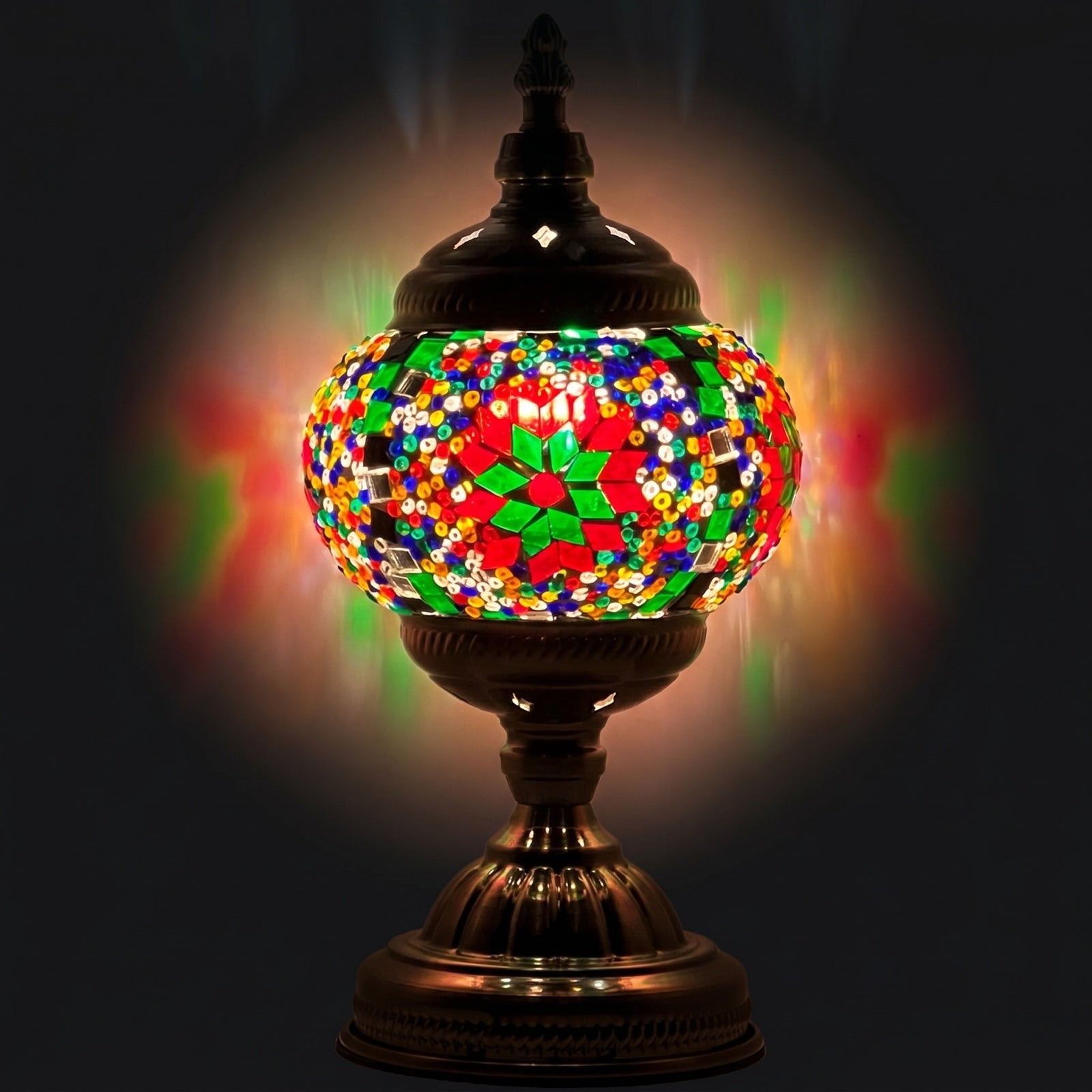 Rainbow Blaze mosaic glass table lamp — glowing against a deep charcoal background