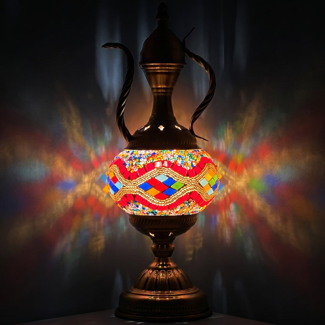 Rainbow Enchantment mosaic glass table lamp — glowing against a deep charcoal background