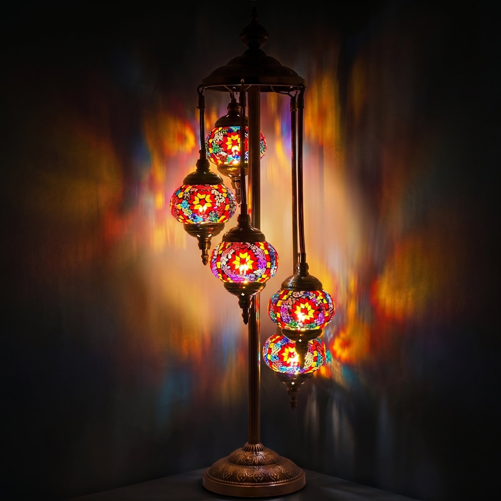 Ruby Majesty mosaic glass table lamp — glowing against a deep charcoal background