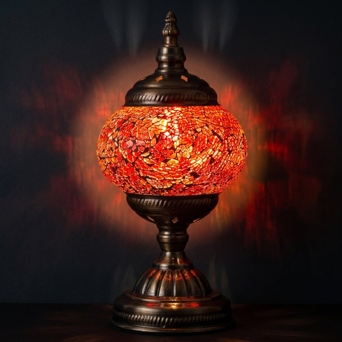 Ruby Radiance mosaic glass table lamp — glowing against a deep charcoal background