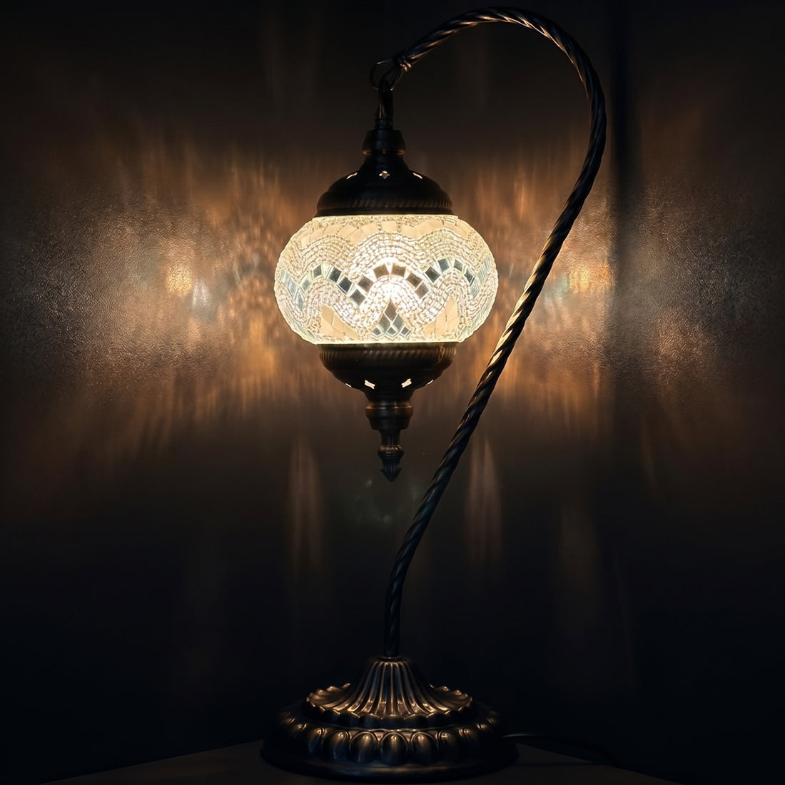 Soft Moonlight mosaic glass table lamp — glowing against a deep charcoal background