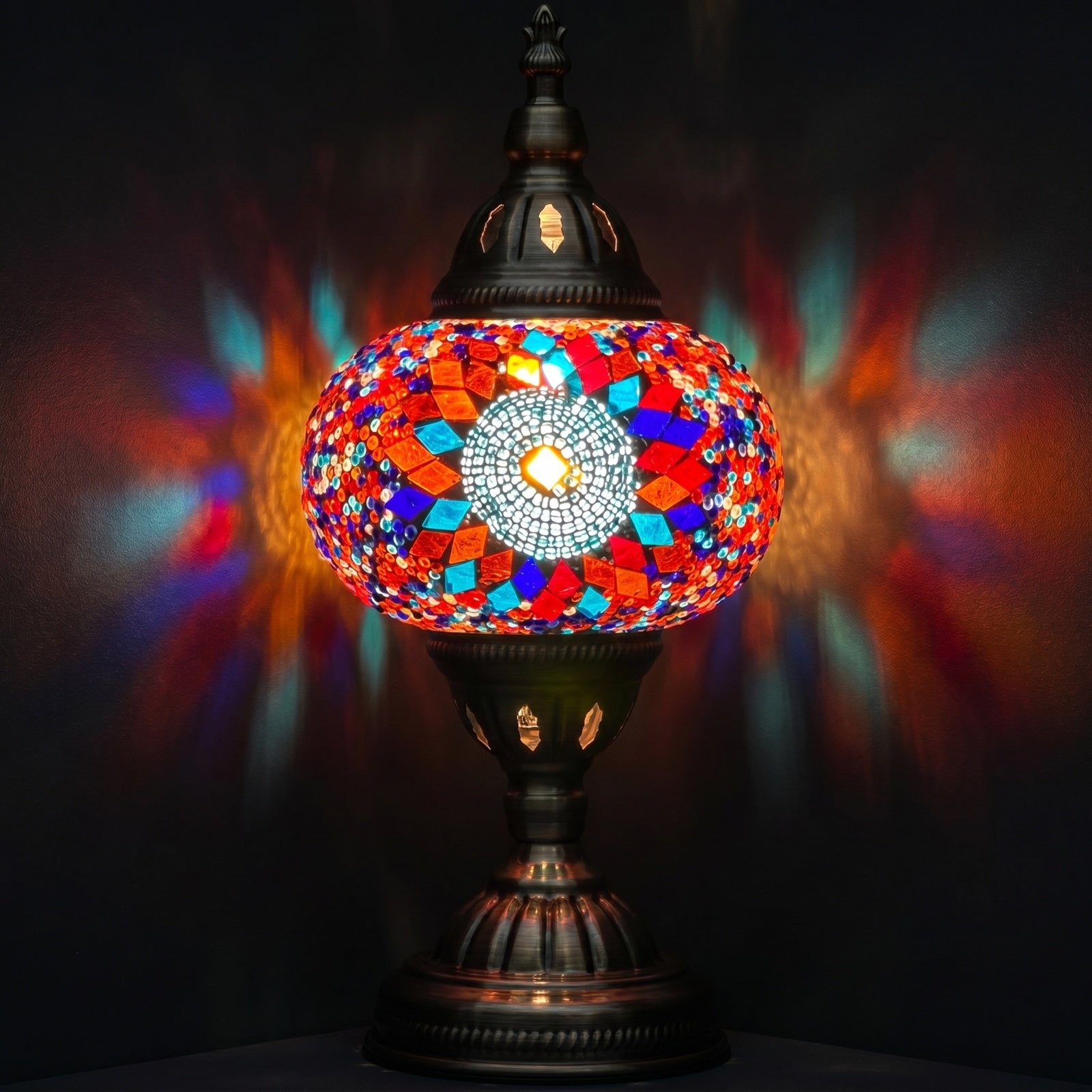 Sunflower Radiance mosaic glass table lamp — glowing against a deep charcoal background