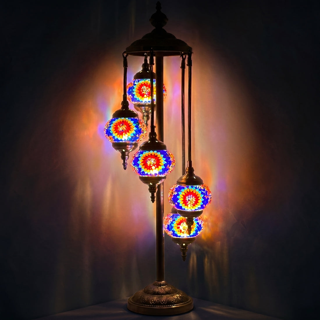 Sunflower Symphony mosaic glass table lamp — glowing against a deep charcoal background