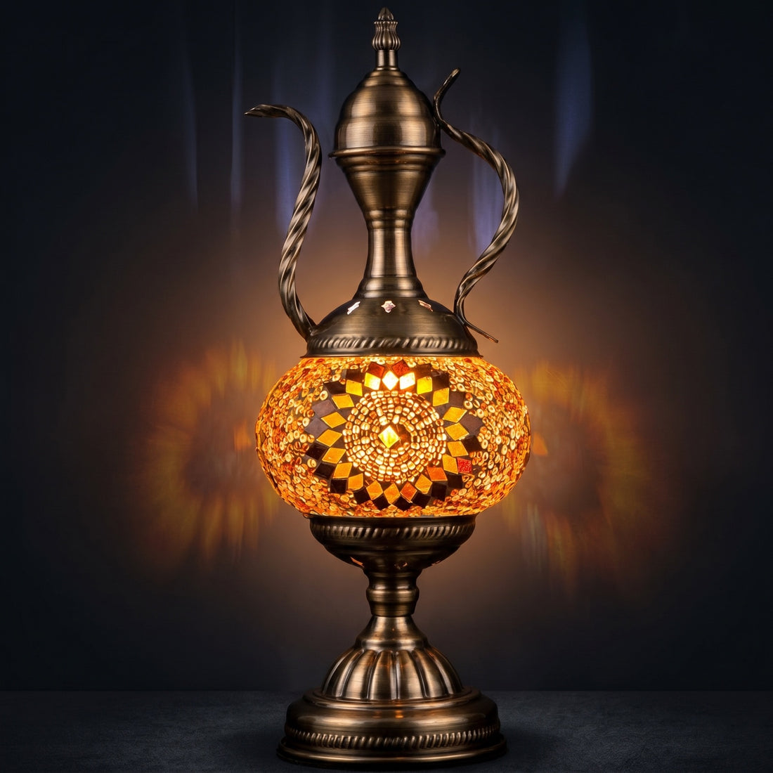 Tangerine Dreams mosaic glass table lamp — glowing against a deep charcoal background
