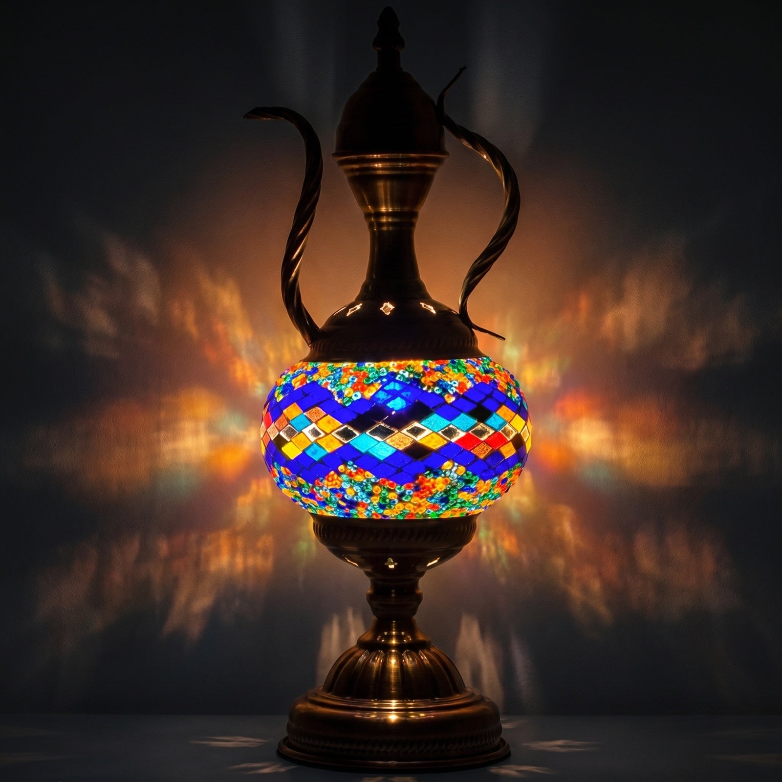Teapot Treasure mosaic glass table lamp — glowing against a deep charcoal background