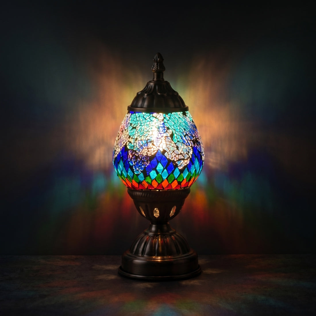Tiffany style Lamp with Mosaic Glasses mosaic glass table lamp — glowing against a deep charcoal background
