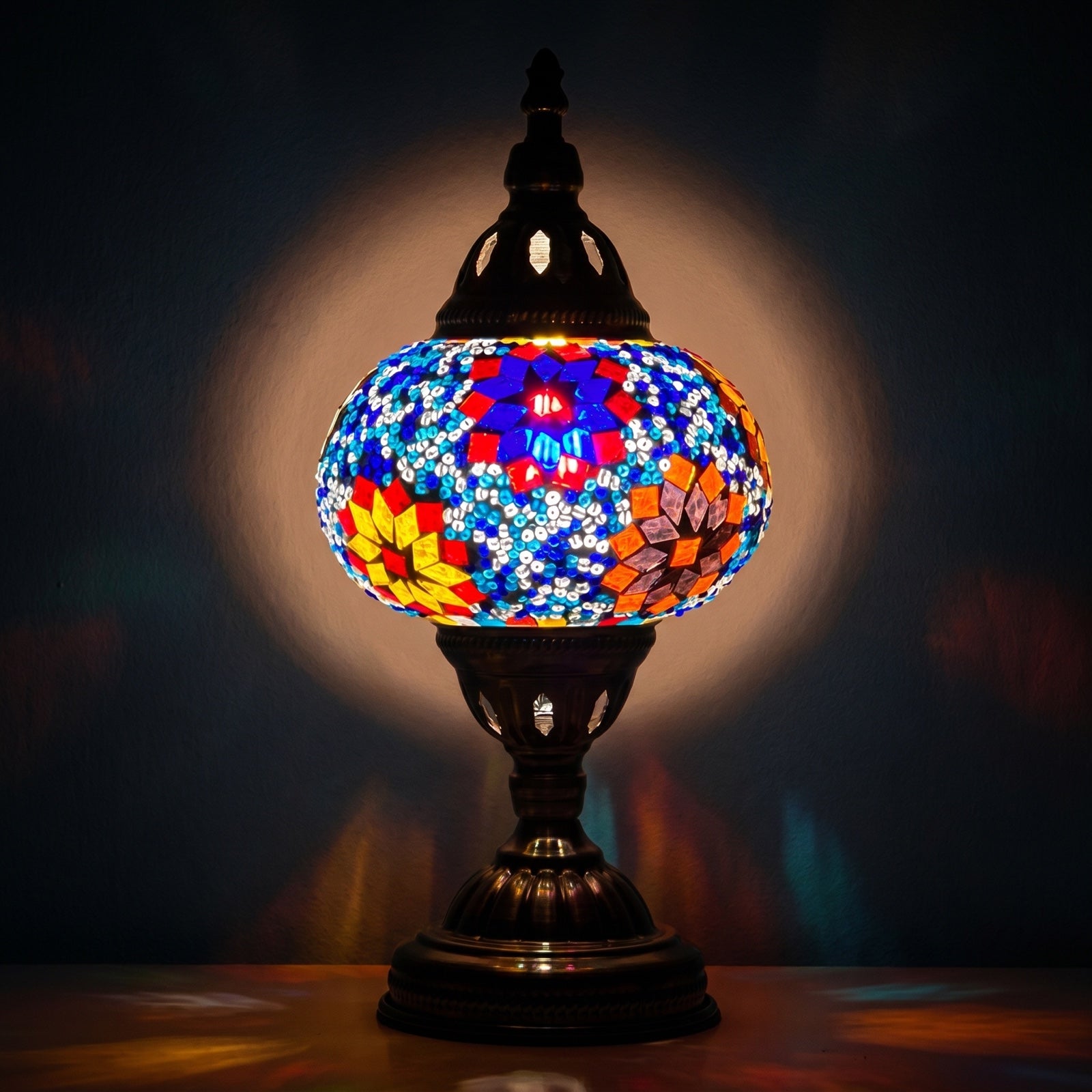 Tropical Elegance mosaic glass table lamp — glowing against a deep charcoal background