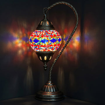 Turkish Lamp with Blue & Red Diamond Patterns mosaic glass table lamp — glowing against a deep charcoal background